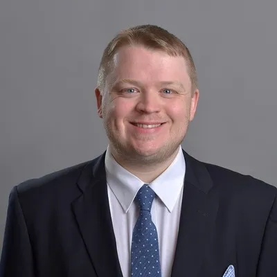 Headshot of Alexander Shaw.