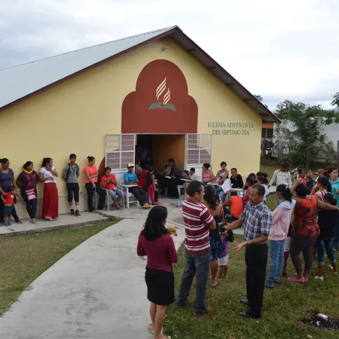 A line of people waiting to be served by the clinical team