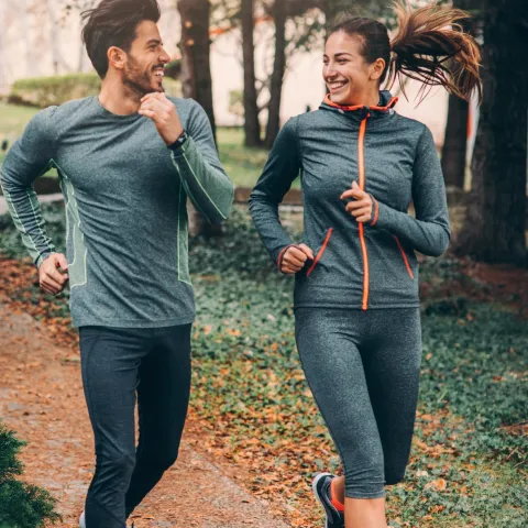 Two Friends Jogging in Park