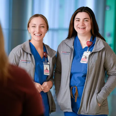 Two Nurses talking to a woman interested in joining the team at UChicago Medicine AdventHealth