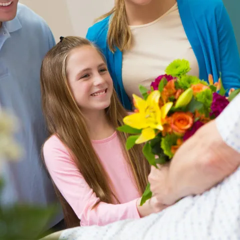 A Girl and Her Family Visiting a Family Member in the Hospital