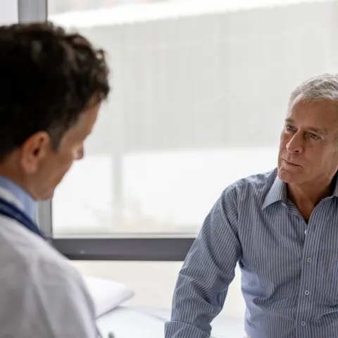 .Older Man talking his doctor about Aquablation.