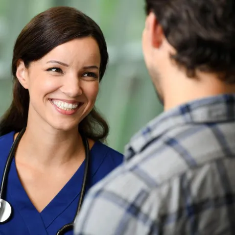 nurse with patient talking