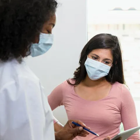 Woman Talking to Doctor About Test Results