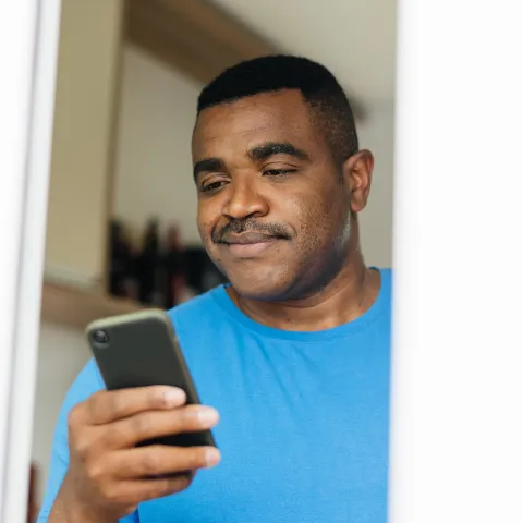 Man reading iPhone 