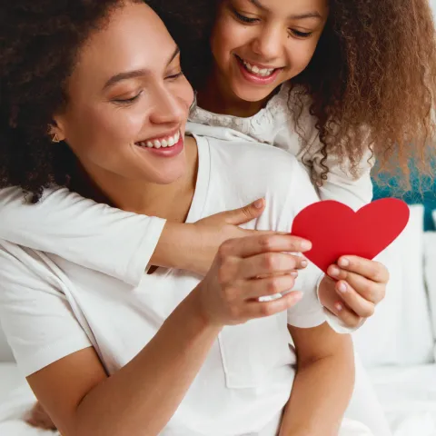 Woman and daughter with heart