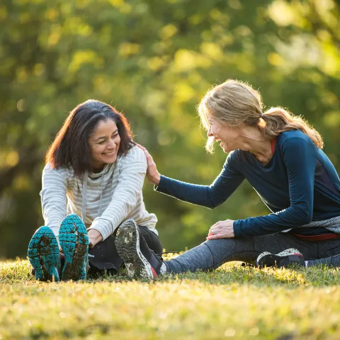 Women Stretching in Park