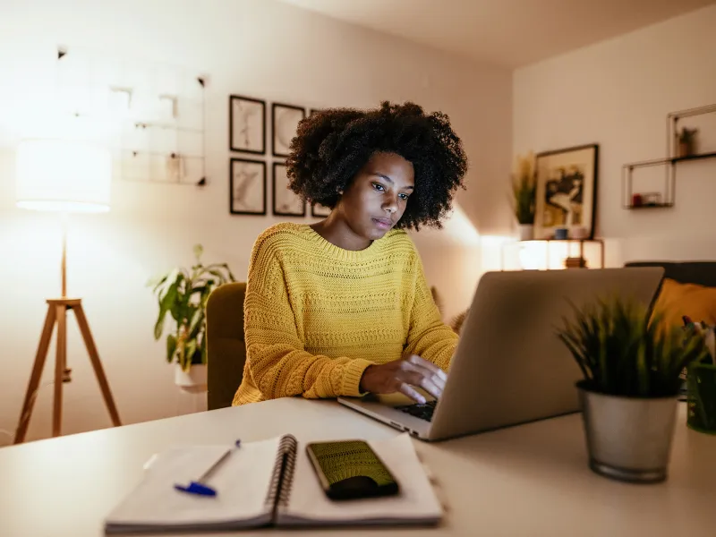 Female Looking at Laptop Researching