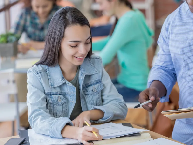 Girl Asking Teacher a Question