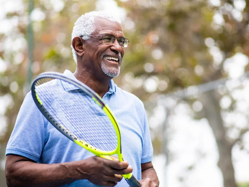 Elder Man Playing Tennis