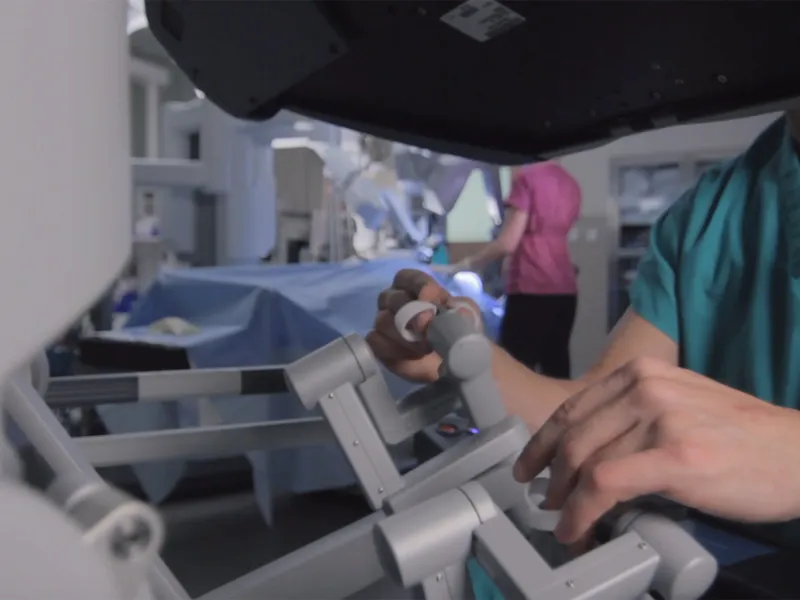Surgeon using a DaVinci robot.
