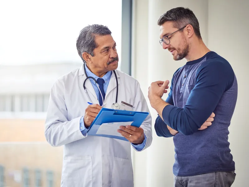 Adult White Man Discusses His Condition With A Doctor