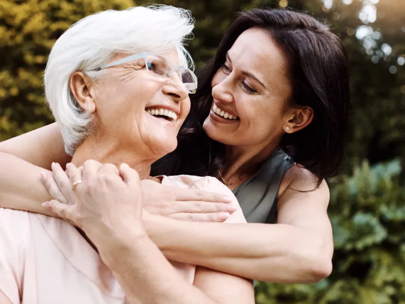 Woman Hugging Older Mother