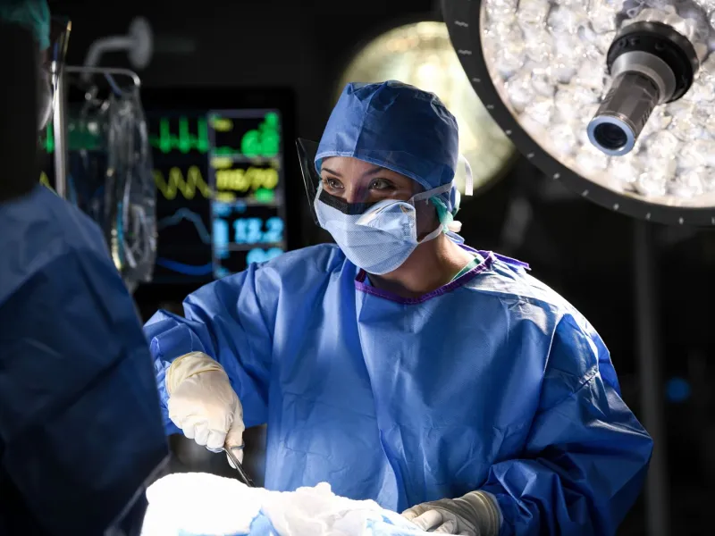Female Surgeon Performing Surgery