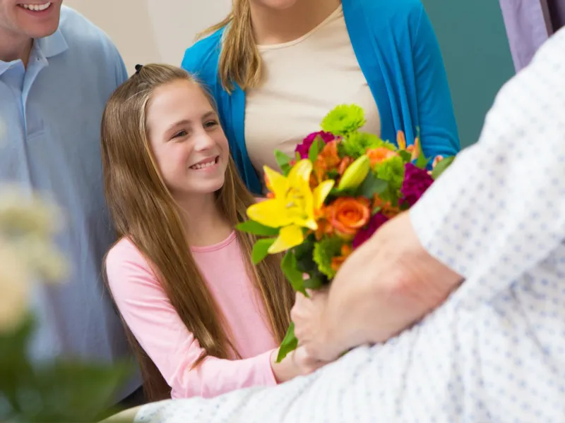 A Girl and Her Family Visiting a Family Member in the Hospital