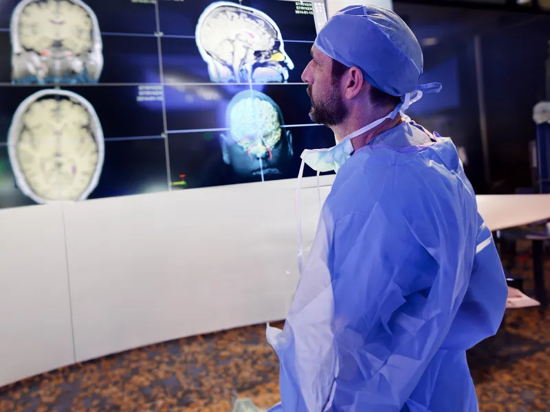 Physician looking at brain scans