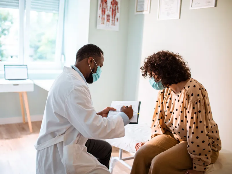 Provider and patient in an office looking at test results
