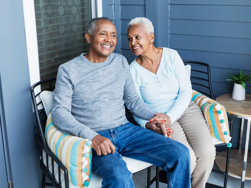Senior couple relaxing on porch outdoors
