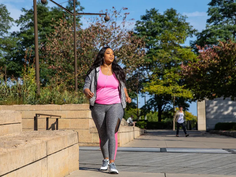 Woman Walking Outdoors in Chicago Area