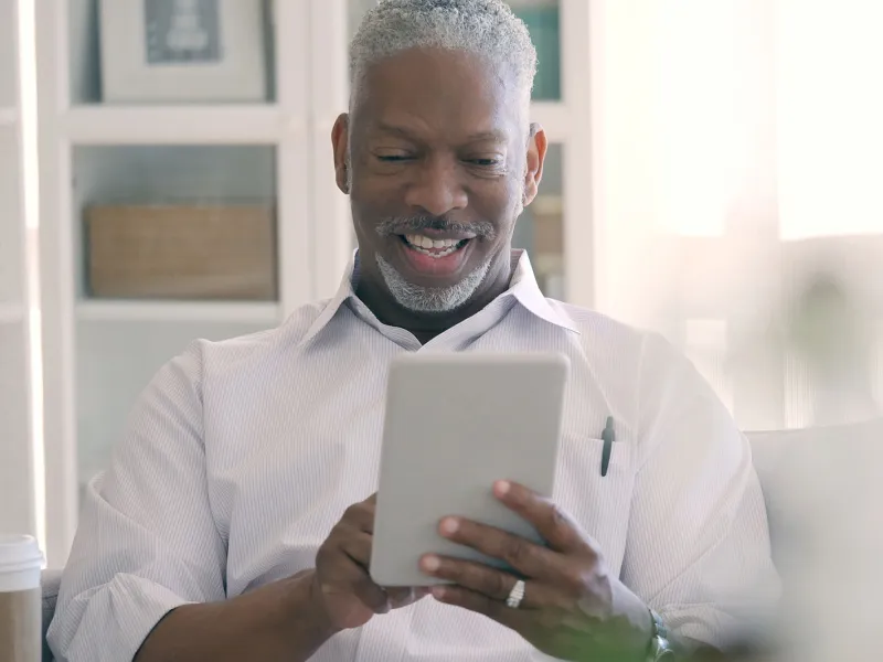 Man on a video call with his physician.