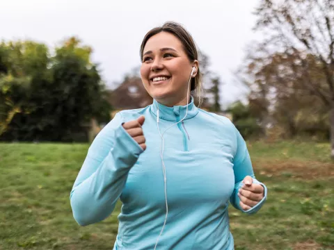 Woman running in park.