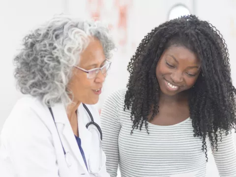 Female Patient Listening to Female Doctor