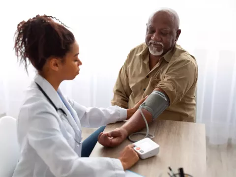 A Physician Checks Her Patient's Blood Pressure