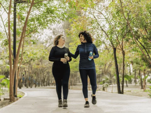 Two woman walking together