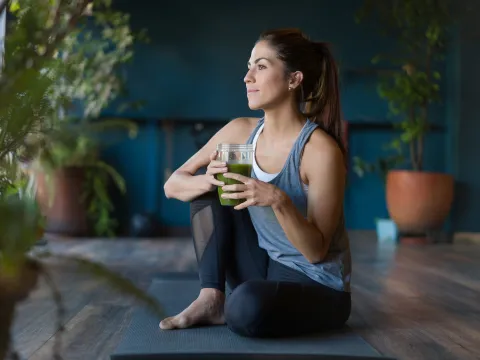 A woman stretching at home.