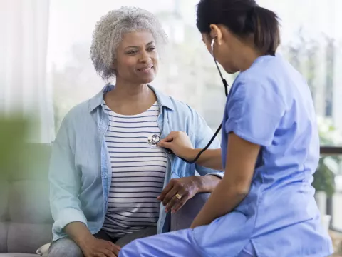 Physician Checking Patient's Heart
