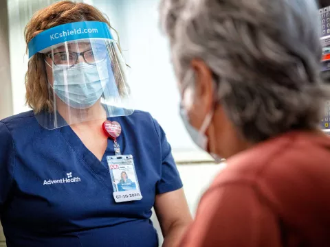 An AdventHealth nurse with a patient