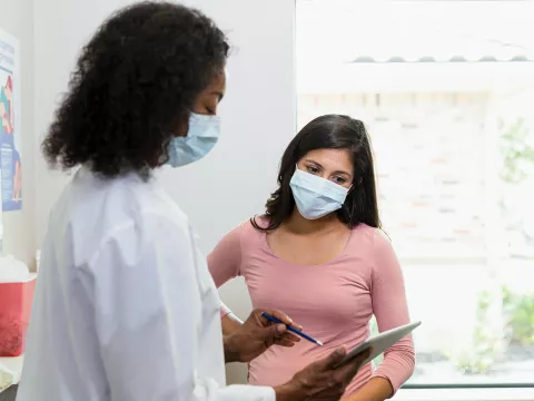 Doctor talking to patient about mammogram results
