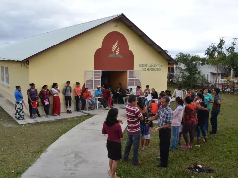 A line of people waiting to be served by the clinical team