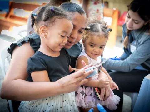 A dominican republic mother with her two daughters 