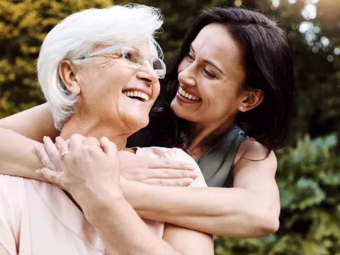 Woman Hugging Older Mother