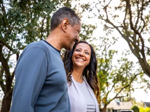 Couple walking outdoors in park