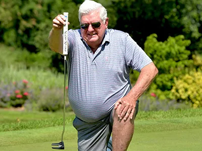 John Brockob Kneeling in Front of Putt