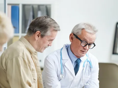 Physician talking to patient about test results.
