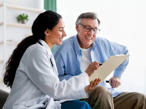 Physician showing results to a patient.