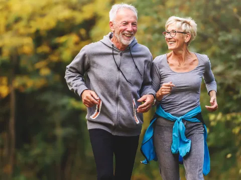 Older Couple Running in Park