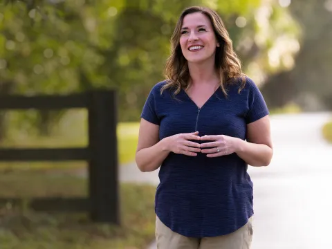 happy woman walking outside