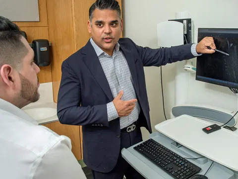Doctor Showing Patient their Spine Image
