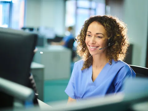 A nurse answering a phone call
