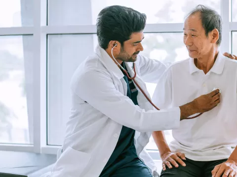 Physician Checking Patient Heart