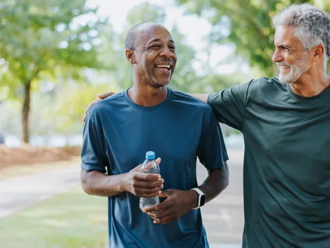 Two Men Walking in Park