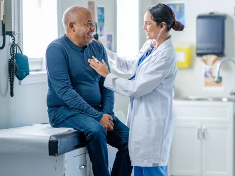 Older male patient with his primary care provider.