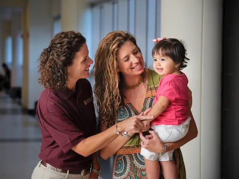 Volunteer playing with child