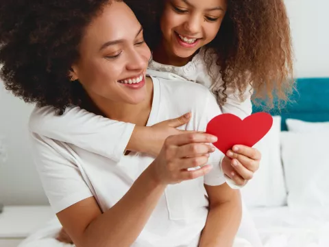 Woman and daughter with heart