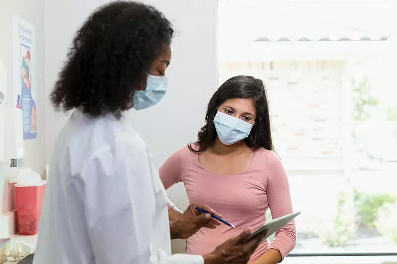 Doctor talking to patient about mammogram results