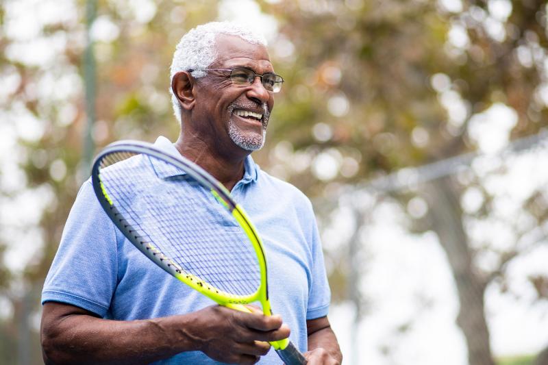 Elder Man Playing Tennis